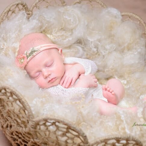 Sleeping newborn baby girl photography session in Sydney studio